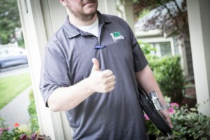 A photo of a 1UP Floors Sales/Service Ninja giving a thumbs up